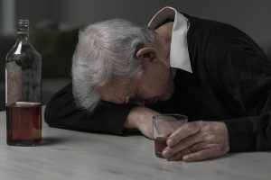 Senior man sleeping after drinking too much alcohol ** Note: Visible grain at 100%, best at smaller sizes